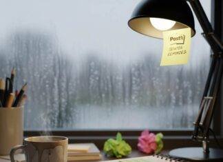 Mental Health Wellness: The Ultimate Guide to Improving Your Emotional Wellbeing A cluttered desk with a coffee mug, notebook, and a rainy window.