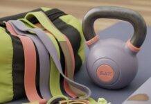 Fitness Accessories for Full Body Workout: 5 Must-Have Tools A tangled pile of resistance bands, a kettlebell, a yoga mat with a coffee stain, and a sticky note saying "Don't skip leg day!"