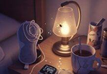 Sleep Disorders and Their Impact on Mental Health A blurry, high-resolution shot of a cluttered nightstand with a flickering sleep tracker, tangled sleep mask, chipped mug with tea stains, and a firefly near a lamp, in muted purples, grays, and gold.