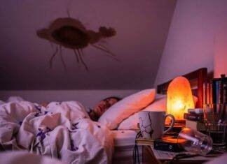 Sleep Therapy Near Me: Your Path to Restful Sleep A blurry, first-person shot of a person in bed, staring at a ceiling with a stain, with a salt lamp and scattered lavender petals.