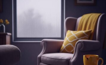 Is Mental Health Therapy Right for You? Everything You Need to Know A blurred therapist's office with a faded armchair, chipped yellow mug, and a red mitten on the floor. Rain streaks the window.