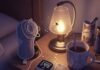 Sleep Disorders and Their Impact on Mental Health A blurry, high-resolution shot of a cluttered nightstand with a flickering sleep tracker, tangled sleep mask, chipped mug with tea stains, and a firefly near a lamp, in muted purples, grays, and gold.