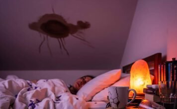 Sleep Therapy Near Me: Your Path to Restful Sleep A blurry, first-person shot of a person in bed, staring at a ceiling with a stain, with a salt lamp and scattered lavender petals.